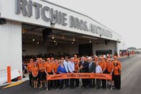 The Ritchie Bros. Geelong team is joined by local officials and friends in cutting the ribbon.