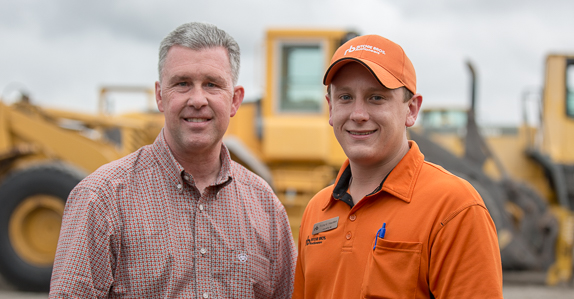 customer poses with his territory manager customer poses with his territory manager