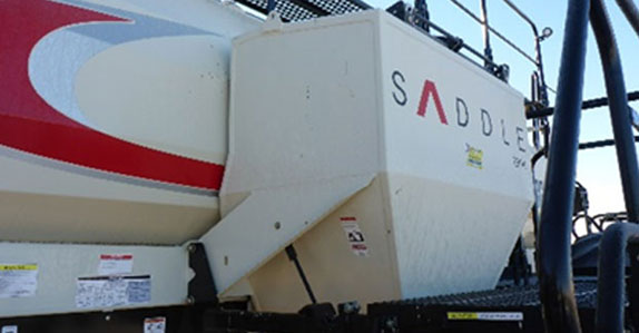 Air drill saddle tank