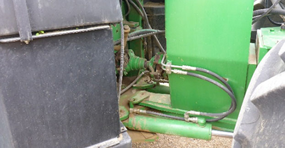 Inspecting farm tractors for sale.