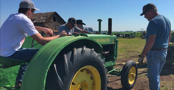 customers inspecting tractors customers inspecting tractors