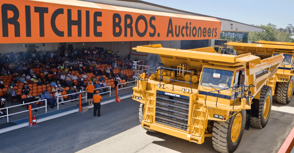 A large mining rock truck makes its way over the auction ramp