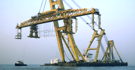 The barge-mounted Asian Hercules crane is over 240 feet long and more than 130 feet wide
